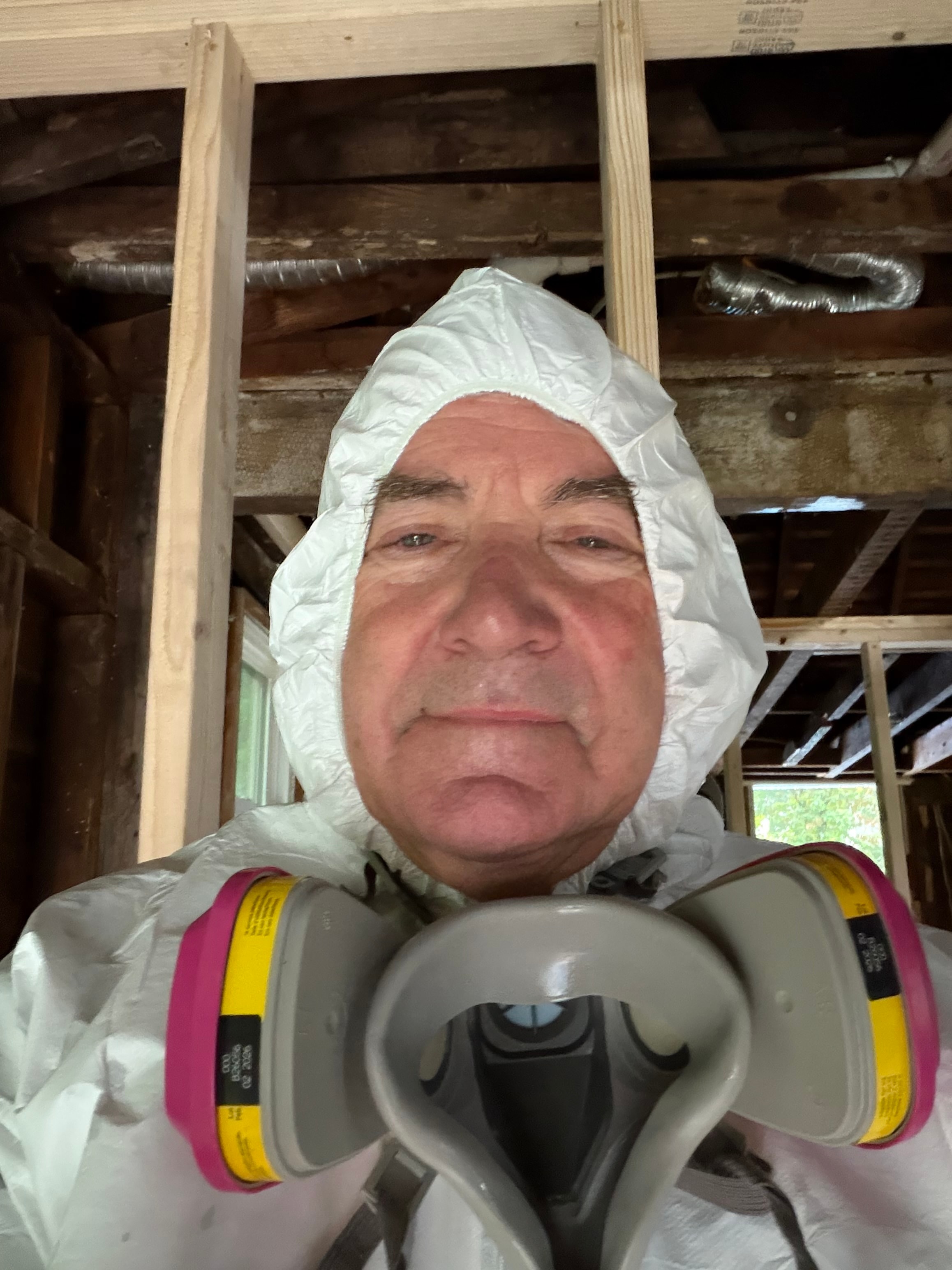 Chad Goodhue, Founder of New England Restoration — on the job in full protective equipment