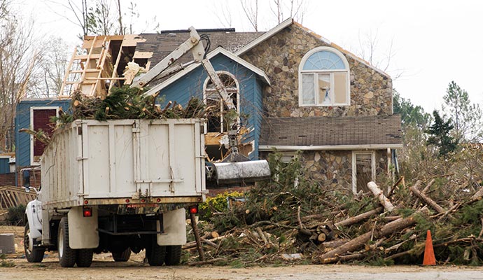 Worker restoring disaster damaged area