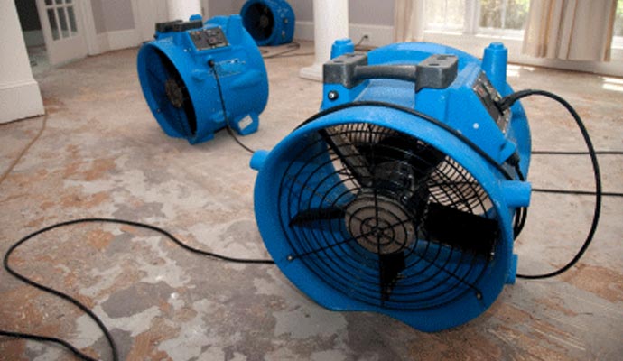 Water damage restoration with professional equipment